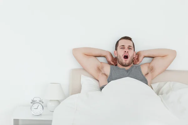 Man yawning while waking up — Stock Photo, Image