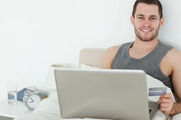 Handsome man shopping online — Stock Photo, Image
