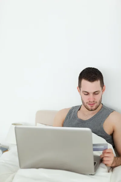 Portrait of a young man shopping online — Stock Photo, Image