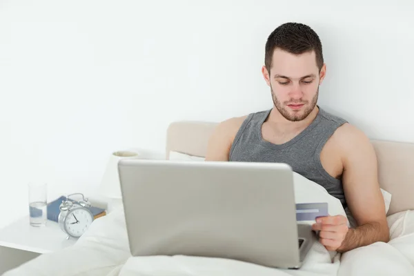 Attractive man shopping online — Stock Photo, Image