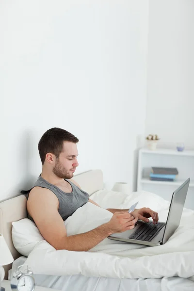 Portrait of a man booking his holidays online — Stock Photo, Image