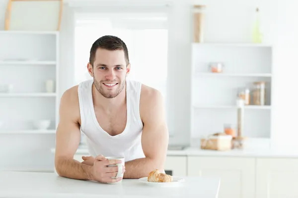 Happy man having breakfast — Stock Photo, Image