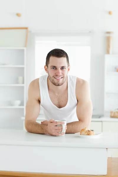Portrait of a happy man having breakfast — Stock Photo, Image