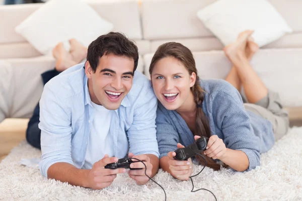 Delighted couple playing video games — Stock Photo, Image