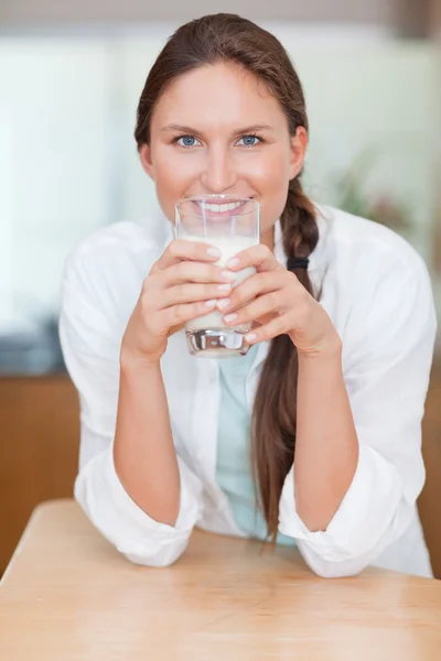 Portrait of a woman drinking milk — Stock Photo, Image