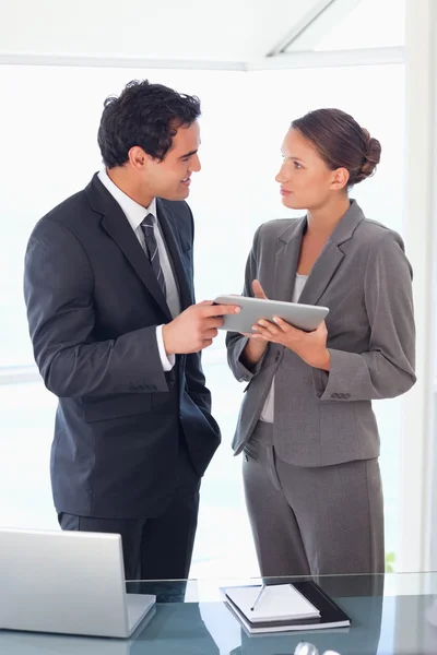 Business partner standing with tablet in their hands — Stock Photo, Image