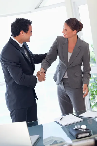 Business partner shaking hands after closing a deal — Stock Photo, Image