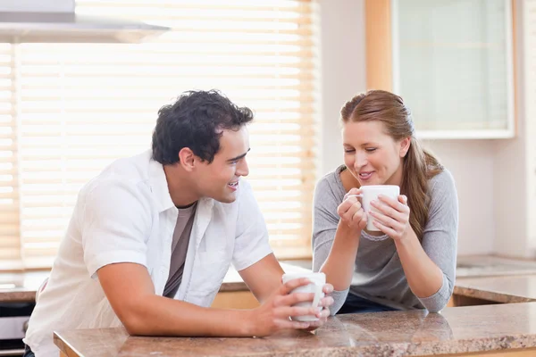 Couple enjoying tea in the kitchen — Stock Photo, Image