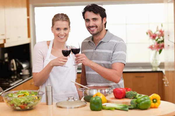 Couple drinking a glass of red wine — Stock Photo, Image