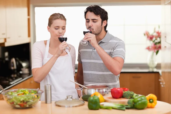 Young couple drinking a glass of wine — Stock Photo, Image