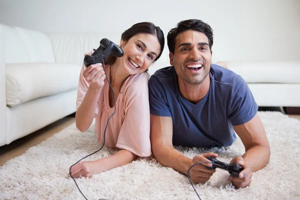 Delighted couple playing video games — Stock Photo, Image
