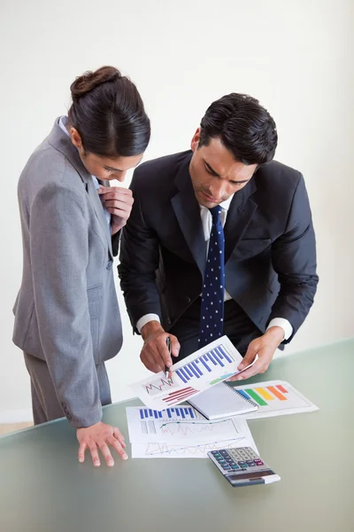 Portrait of focused sales persons studying statistics — Stock Photo, Image
