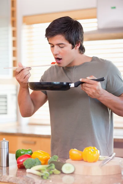 Portrait of a man tasting his meal — Stock Photo, Image