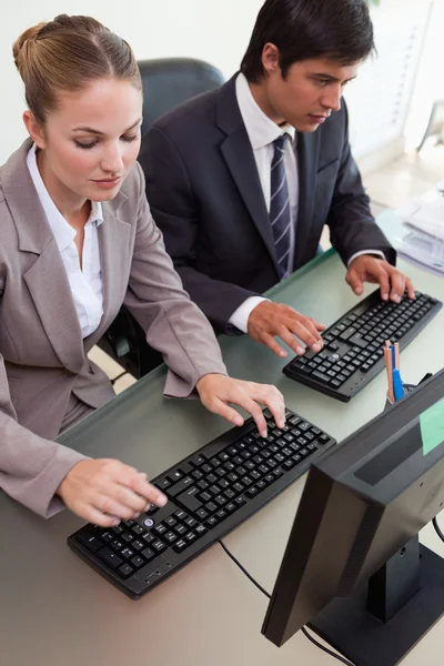 Portrait of young business working with computers — Stock Photo, Image
