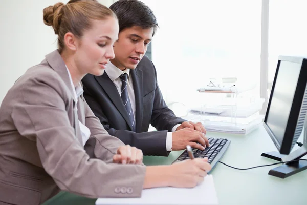 Young business working with a computer — Stock Photo, Image