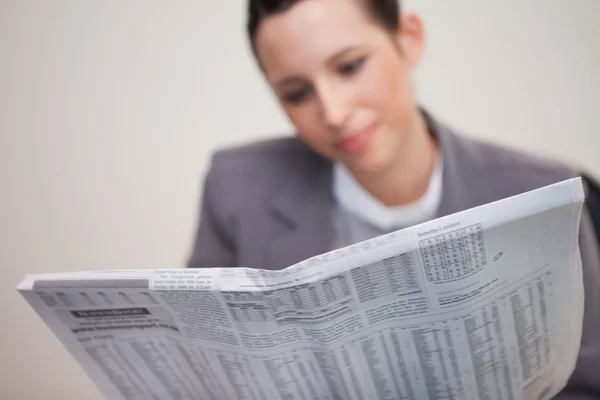 stock image Newspaper being read by businesswoman