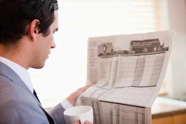 Side view of businessman reading newspaper — Stock Photo, Image