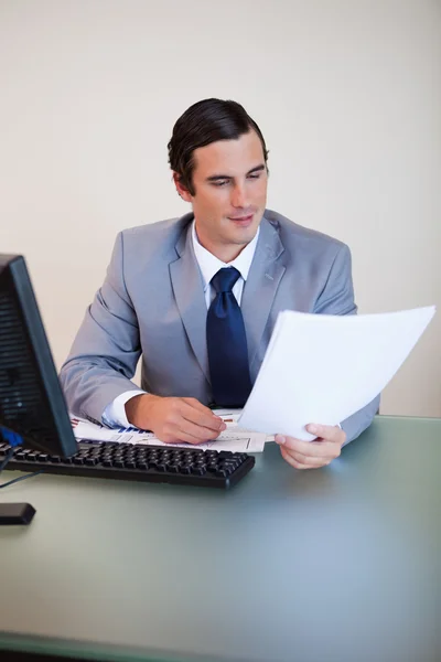 Businessman having a look at a contract — Stock Photo, Image
