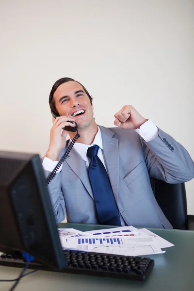 Cheerful businessman on the phone — Stock Photo, Image