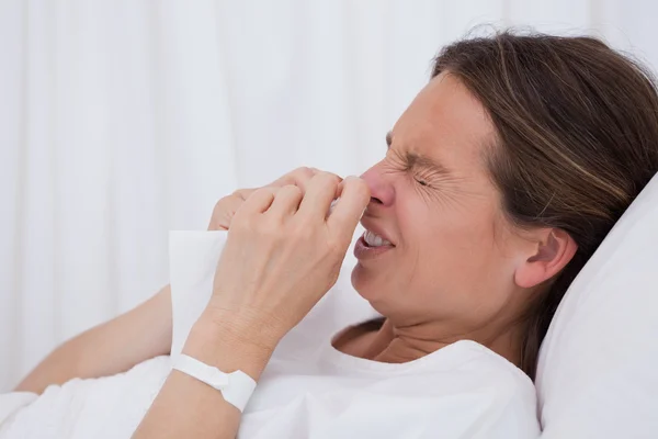 Side view of sneezing woman — Stock Photo, Image