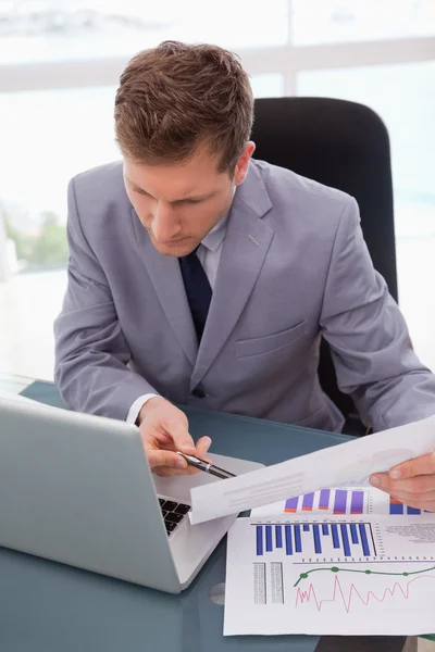 Businessman looking at his laptop — Stock Photo, Image