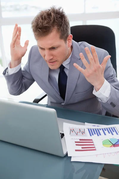 Businessman getting furious over laptop — Stock Photo, Image
