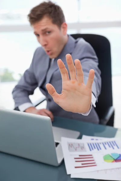 Hand of businessman used to signal stop — Stock Photo, Image