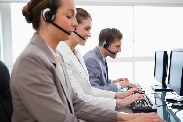 Side view of customer service employees — Stock Photo, Image