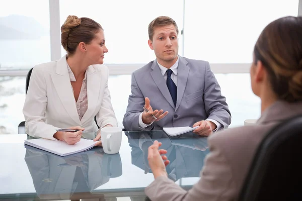 Business partners talking with lawyer — Stock Photo, Image