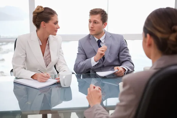 Business team deliberating with lawyer — Stock Photo, Image