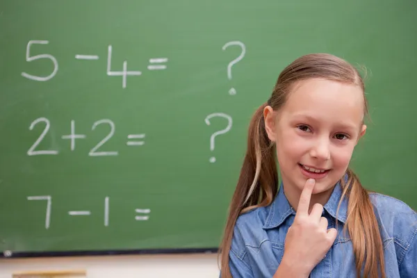 Cute schoolgirl thinking — Stock Photo, Image
