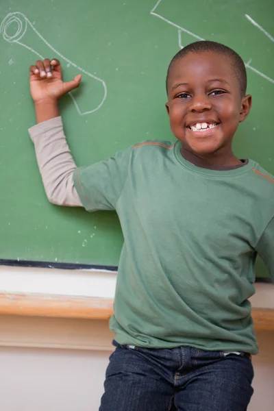 Portrait of a schoolboy showing something — Stock Photo, Image