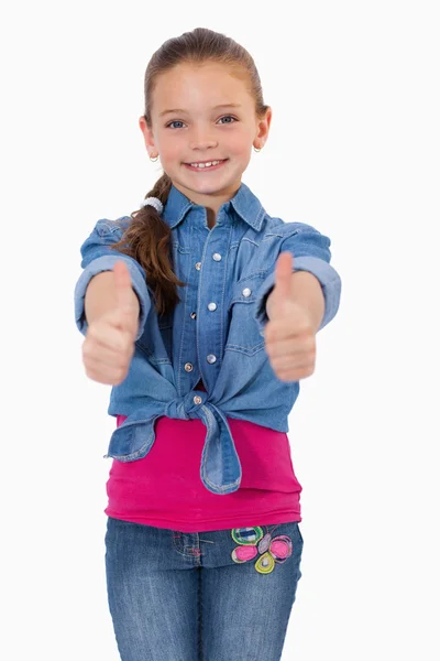 Portret van een meisje met de duimen omhoog — Stockfoto