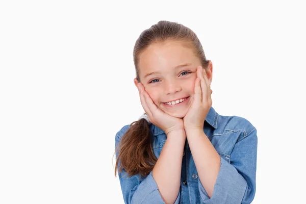 Girl posing with her hands under her chin — Stock Photo, Image