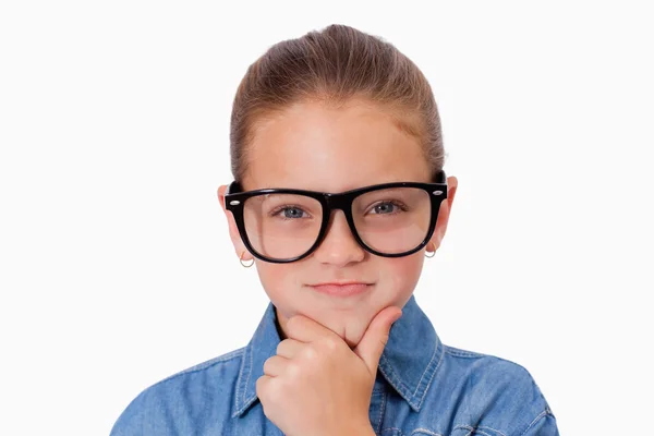 Girl thinking with her hand on her chin — Stock Photo, Image