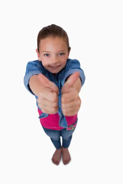 Retrato de una chica juguetona con los pulgares arriba — Foto de Stock