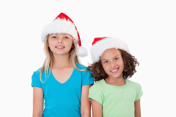 Girls with Christmas hats — Stock Photo, Image