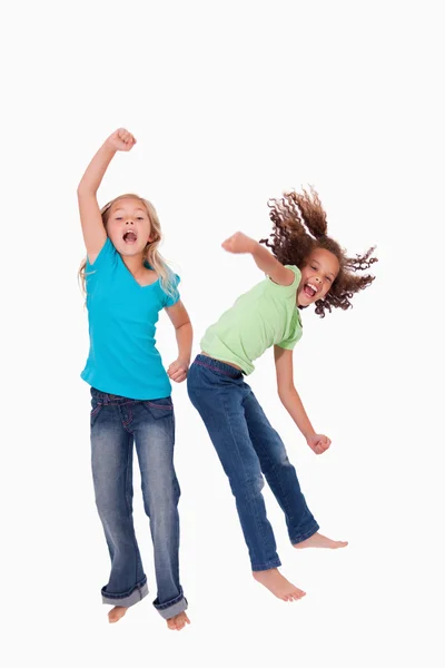 Portrait of cheerful girls jumping — Stock Photo, Image