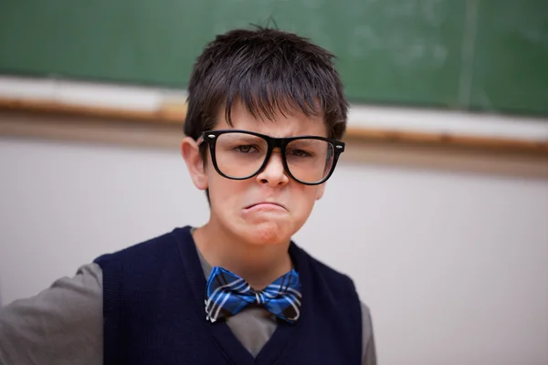 Grumpy schoolboy posing — Stock Photo, Image
