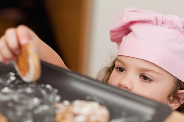 Girl stealing a cookie — Stock Photo, Image