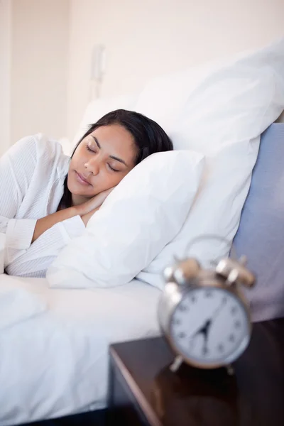 Side view of woman sleeping in her bed — Stock Photo, Image