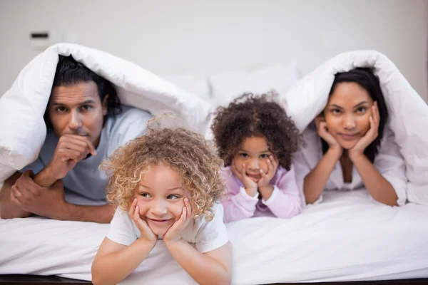 Family playing in the bedroom — Stock Photo, Image