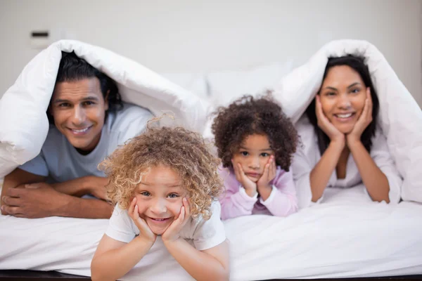 Family playing in the bedroom together — Stock Photo, Image