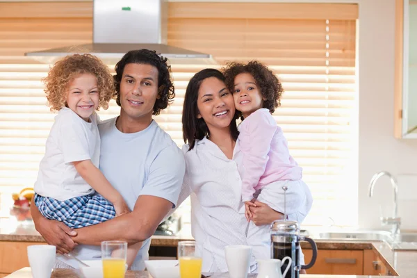 Family having breakfast in the kitchen together — Stock Photo, Image