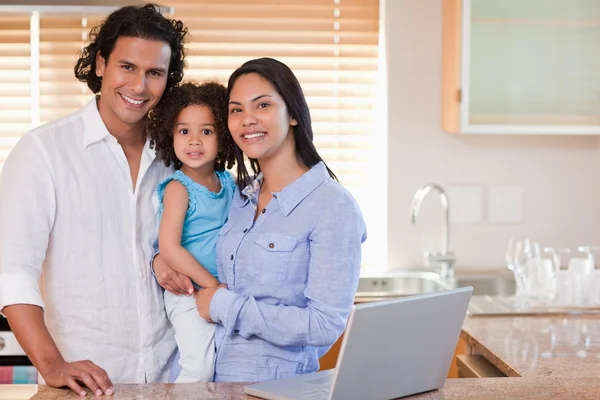 Smiling family together in the kitchen — Stock Photo, Image