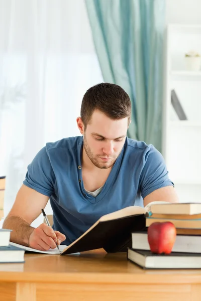 Student working through subject materials Royalty Free Stock Images
