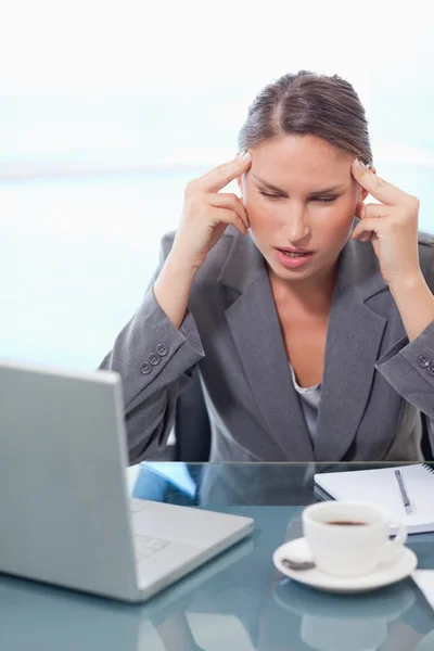 Portrait of a businesswoman having a headache Stock Picture
