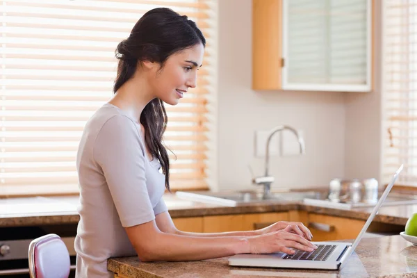 Lovely woman using a laptop — Stock Photo, Image