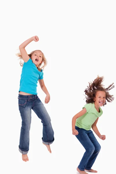 Portrait of girls jumping Royalty Free Stock Photos