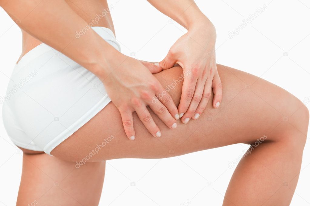 Woman touching her thigh Stock Photo by ©Wavebreakmedia 11201091